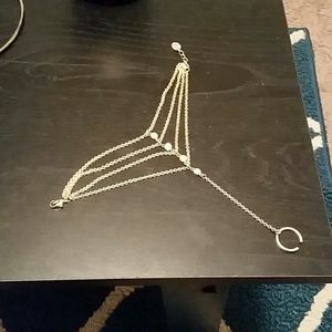 Gold bracelet with ring attachment