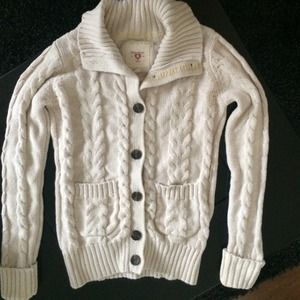 A cute beige sweater from forever 21 with buttons.