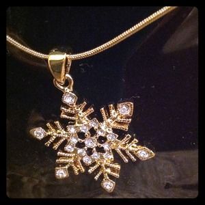 Delicate gold snowflake necklace