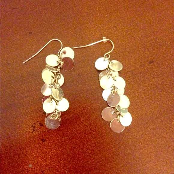 Silver colored circle dangly earrings