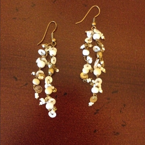 Gold and white dangly earrings