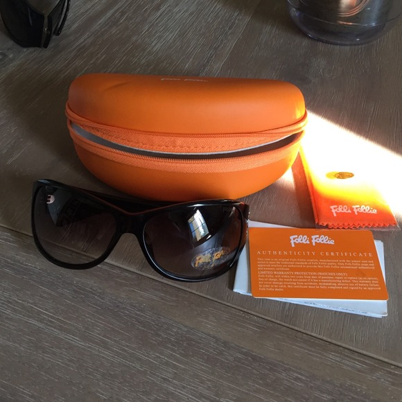 Brand new Folli Follie dark brown sunglasses.