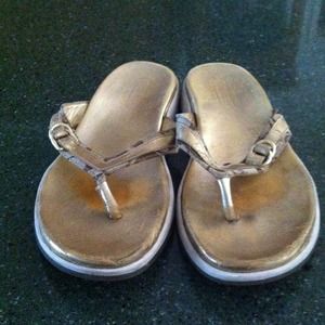 Coach-  golden flip flops- size 8.5