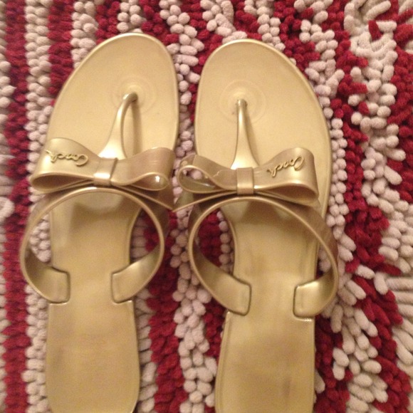 Coach gel bow tie signature shoes in gold