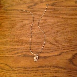 Pearl necklace with diamonds around it