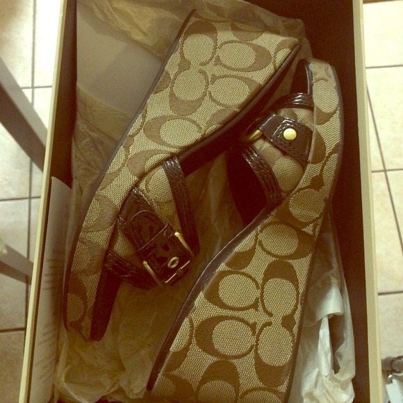 Brown Coach slip ons with heel