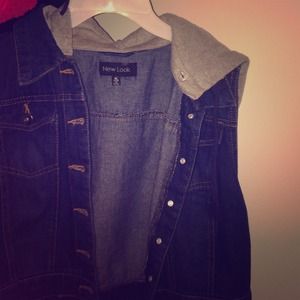 A sleeveless jean jacket