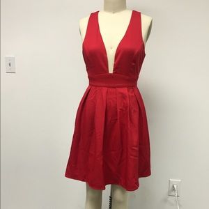 Red plunging pleated dress