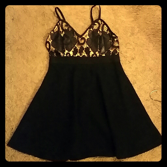 Very cute black dress with leather and nude detail