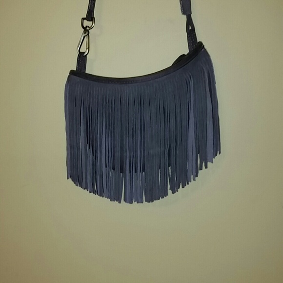 Gray fringe shoulder purse.