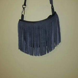 Gray fringe shoulder purse.