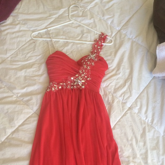 Coral colored high low home coming dress.