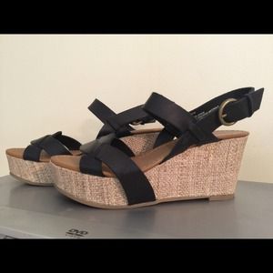 Wedge shoes with black straps.
