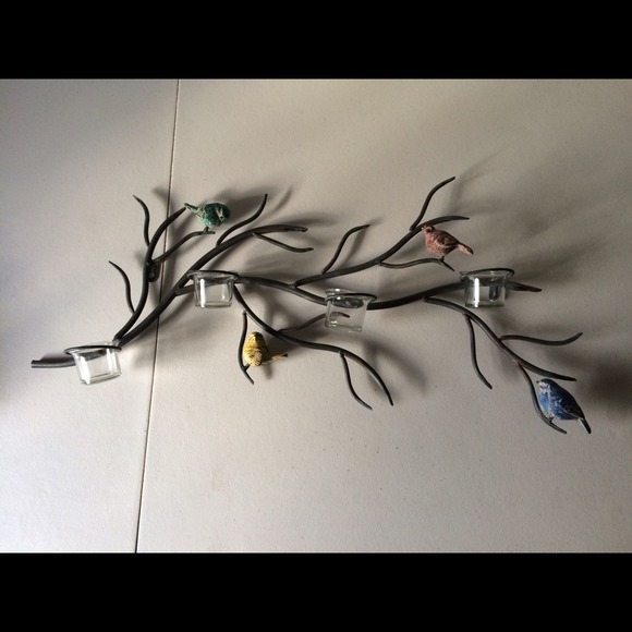 Metal birds on breach wall decor.