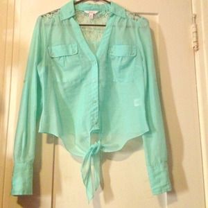 •Buttoned teal blouse•