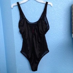 Black part sheer polka dot one piece.