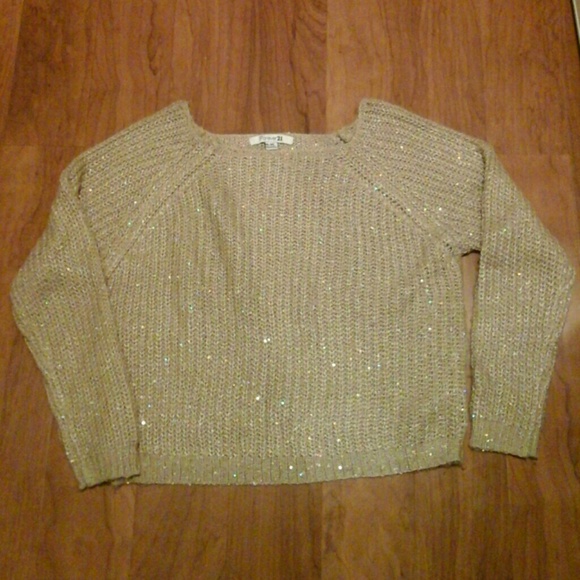 A Forever 21 knitted gold sweater with sparkles