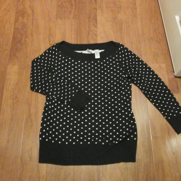 A black and white polka dot sweater