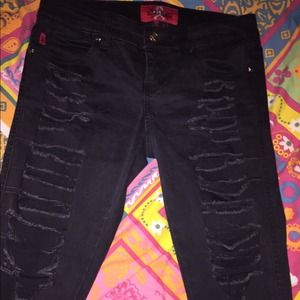 Distressed black skinny jeans