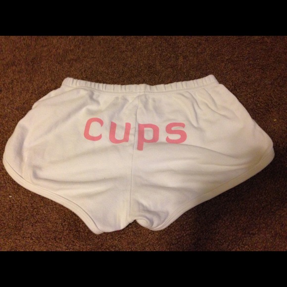 White shorts that say "cups" on the back
