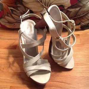Soft creamy leather straps on wooden heel. Size 10