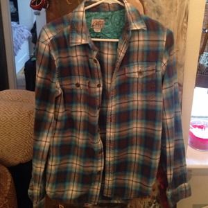 Blue plaid shirt.