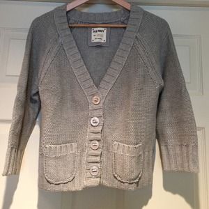 Gray button-down sweater. (C)