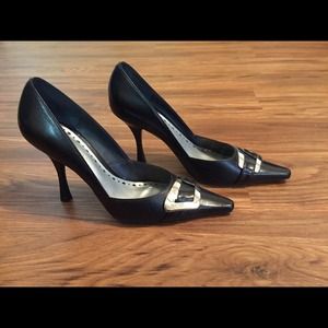 Like new BCBGirls black leather pumps. Size 7