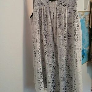 Sleeveless white lace mini dress