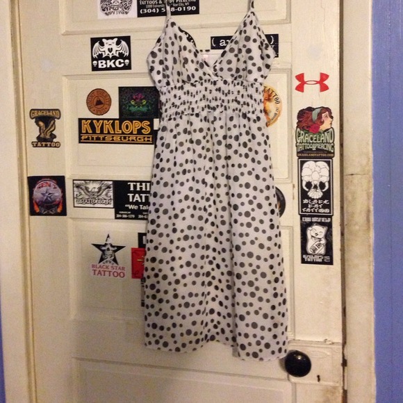 Tempted white, with black polka dots dress.