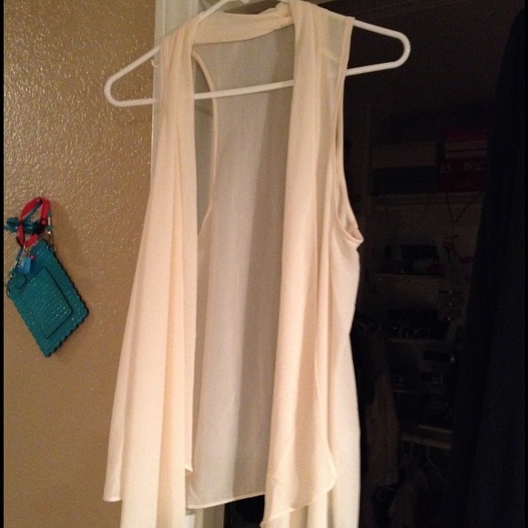 Tan colored top. Goes over tank or shirt