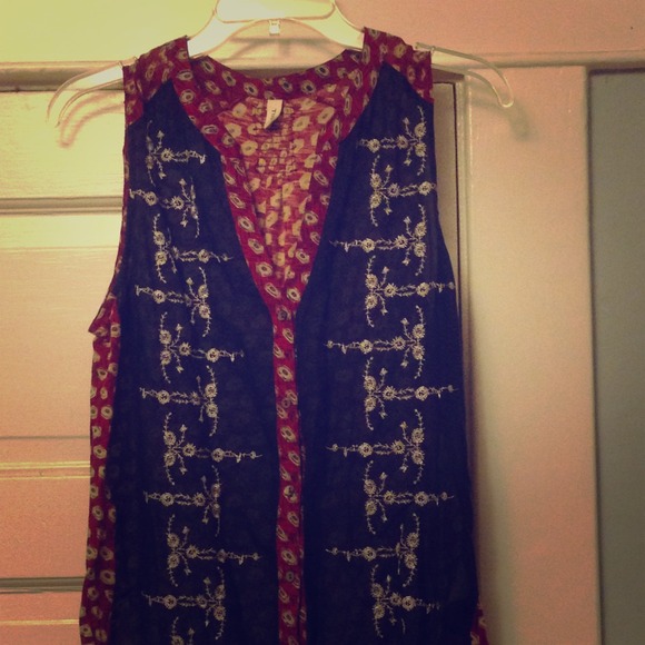 Anthropologie "Tiny" sheer sleeveless blouse.