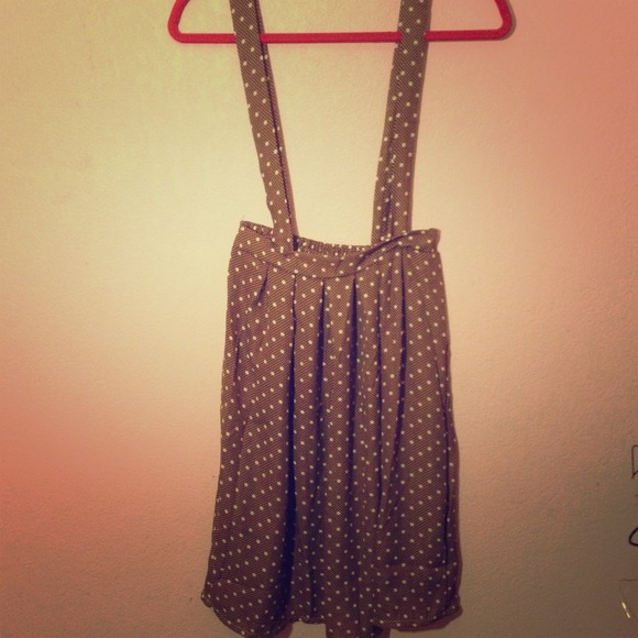 Light brown polka dot suspender skirt.