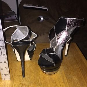 Never worn uber-high black and silver heels