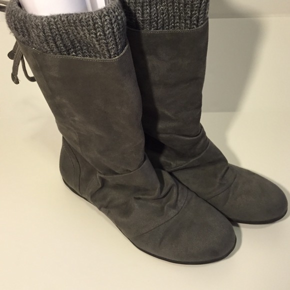 Gray flat boots.
