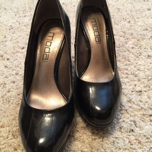 Women's black leather pumps.