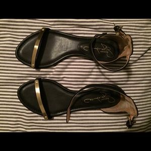 Black leather sandals with gold
