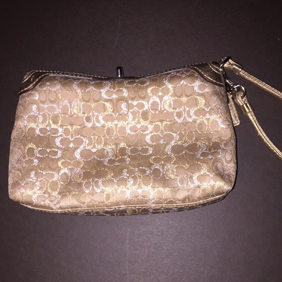 Gold authentic coach clutch with wriststrap