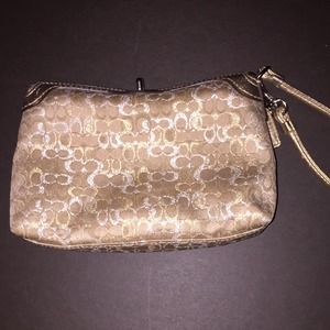 Gold authentic coach clutch with wriststrap
