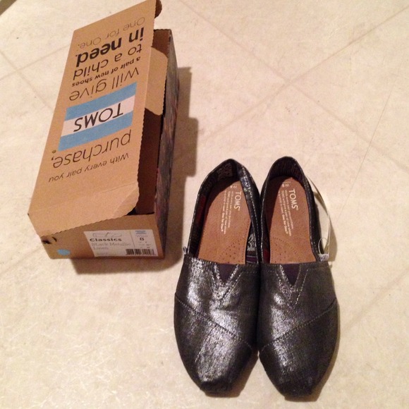 Toms.size 8. Brand new. Black metallic linen