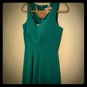 Green cocktail dress with pockets