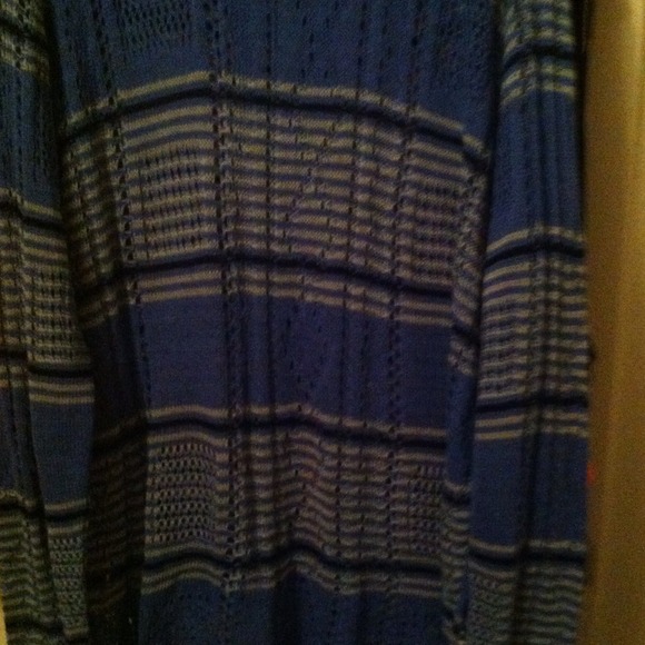Blue,black long sleeve with opening to the back.