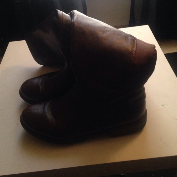 A brown pair of riding boots