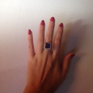 Costume ring with sapphire colored stone