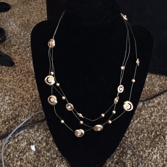 Gold colour light and delicate necklace.