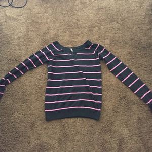 Pink and grey striped sweater .
