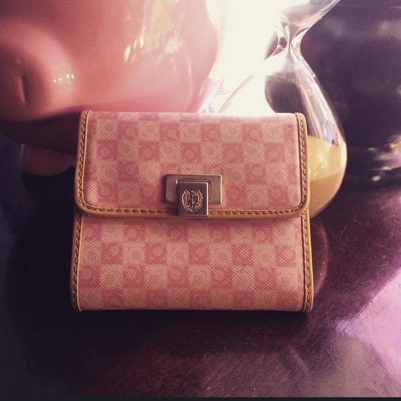 Rosy pink wallet with brown trim.