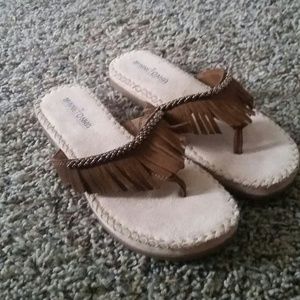 RESERVED Minnetonka fringe flip flops