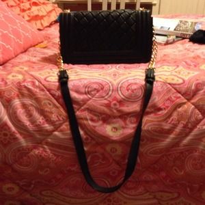 Black satchel with gold chain