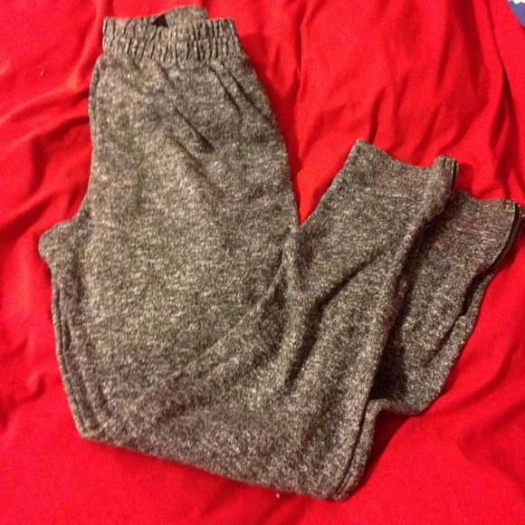 Gray fitted pants with zipper bottoms